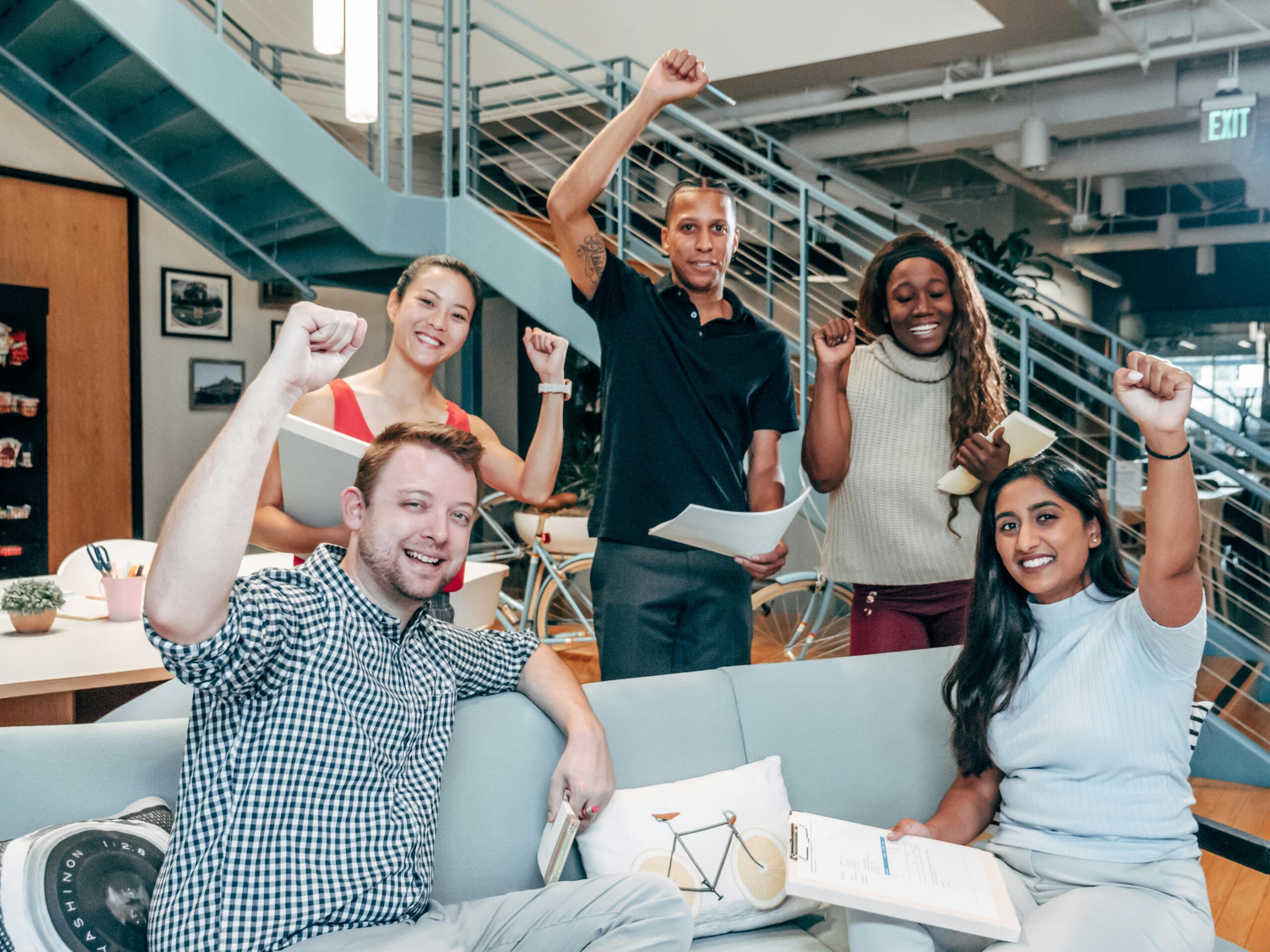 A group of employees celebrating the success of a project.